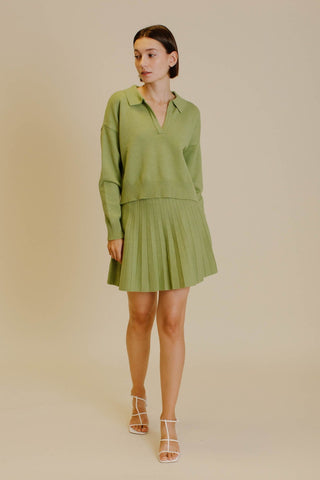 Green knit set. Matching cropped sweater and pleated knit skirt.